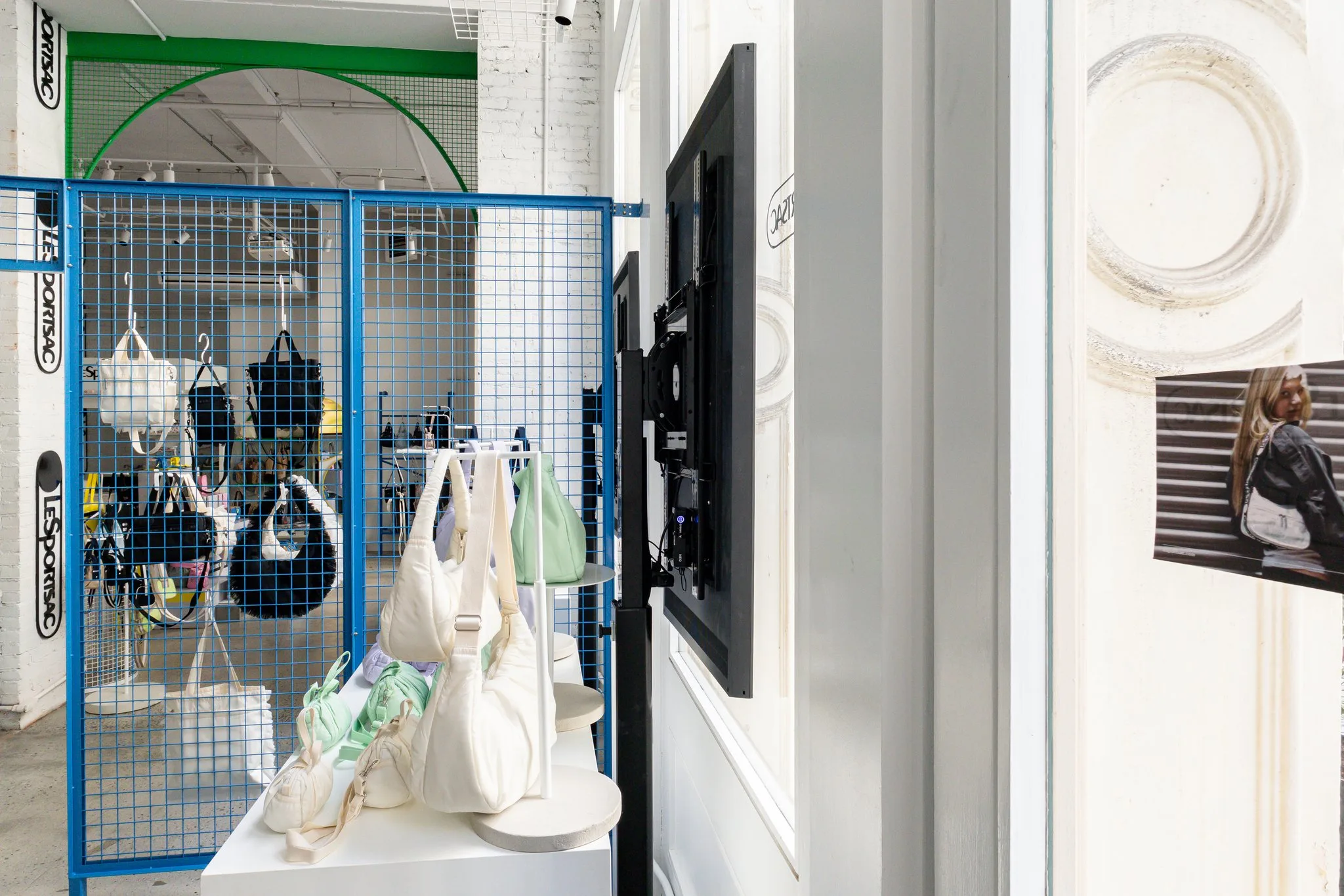 Rear and side view of a LeSportsac window display showing its actual mounting and equipment placement